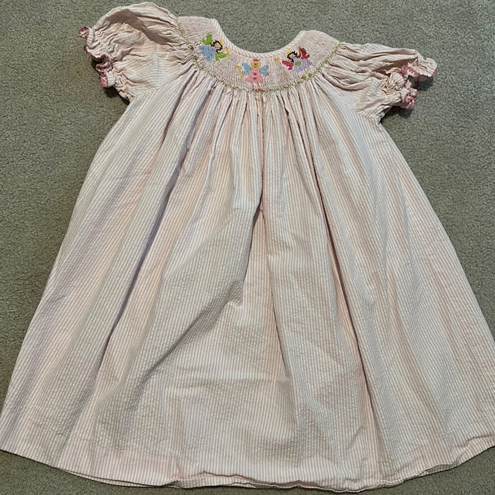 Pink embroidered smock dress with fairy princesses
